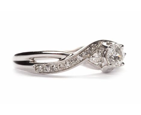 EIGHTEEN CARAT WHITE GOLD DIAMOND DIAMOND RINGthe round brilliant cut diamond of approximately 0.24 carats on diamond set twi