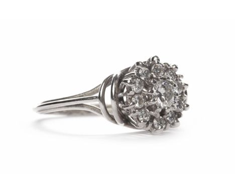 MID TWENTIETH CENTURY DIAMOND CLUSTER RINGthe round bezel 11mm diameter and set with round brilliant cut diamonds, in eightee