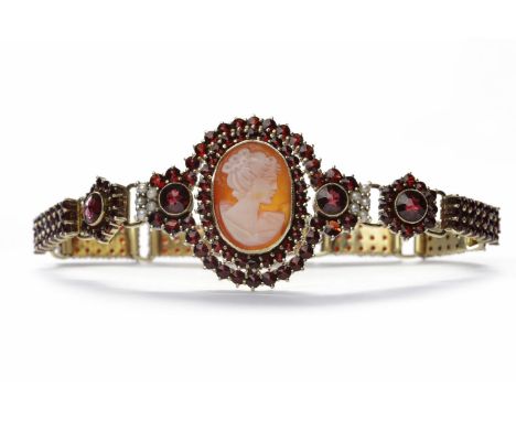 CAMEO AND GARNET SET BRACELETset with an oval cameo of a woman 18.5mm high in a garnet and pearl surround, the bracelet with 