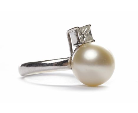 PEARL AND DIAMOND RINGset with a single spherical pearl 11mm set beside a single princess cut diamond of approximately 0.40 c