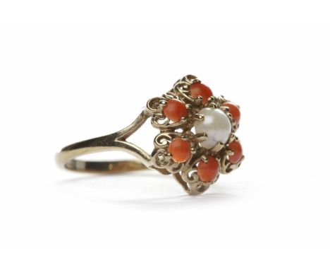 PEARL AND CORAL DRESS RINGthe central white round split pearl surrounded by round sections of coral, in nine carat gold, size