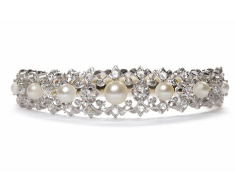PEARL AND DIAMOND SET BANGLEopenwork and set with graduated spherical white pearls, the largest pearl 7.20mm, the smallest pe