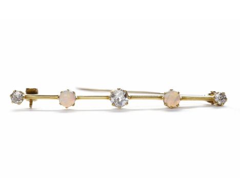 EARLY TWENTIETH CENTURY OPAL AND DIAMOND BAR BROOCHset with three graduated diamonds totalling approximately 0.37 carats inte