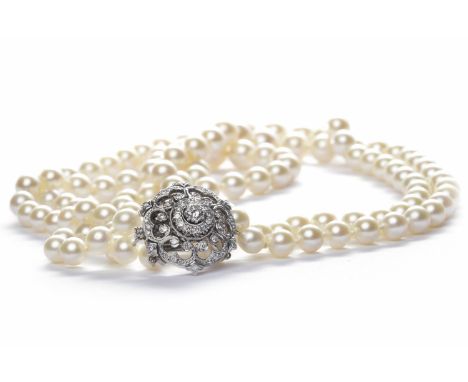 THREE STRANDED PEARL NECKLACEformed by graduated spherical white pearls, the largest pearl 10.50mm, the smallest pearl 7mm, w