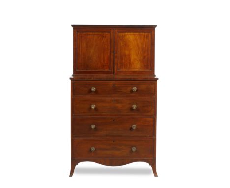 A REGENCY MAHOGANY CABINET CHEST the twin panelled cupboard doors above decorated with ebony stringing, enclosing a single ad