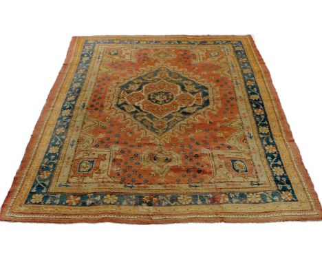 AN ANTIQUE TURKISH POLYCHROME SMALL CARPET with a central medallion, all over stylised foliate designs within a multiple band