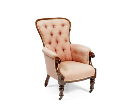 A VICTORIAN MAHOGANY ARMCHAIR, the shaped button upholstered back and overstuffed button upholstered arms with scroll termina