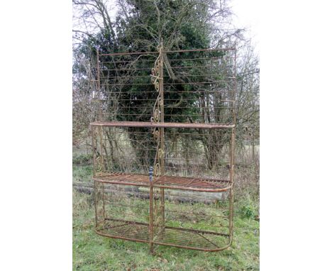 A 19TH CENTURY FRENCH WROUGHT IRON BREAD RACK with three shaped shelves and with scrolling bracket supports, 165.5cm wide x 2
