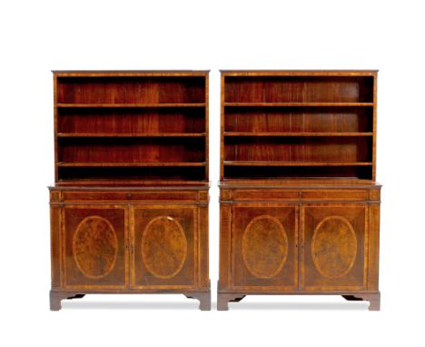 A PAIR OF GEORGE III MAHOGANY BOOKCASE CABINETS, the superstructure with rosewood fronted open bookshelves above a base with 