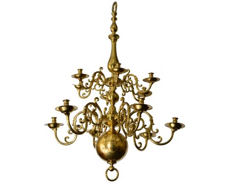 A LARGE 19TH CENTURY DUTCH STYLE BRASS TWO TIER TWELVE LIGHT CHANDELIER with a turned central stem and scrolling branches, ap