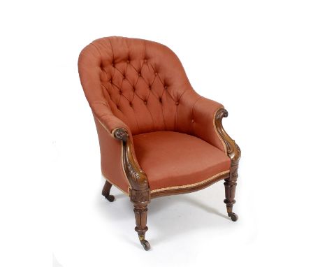 AN EARLY VICTORIAN MAHOGANY FRAMED RED BUTTON BACK UPHOLSTERED TUB CHAIR with carved scrolling arms and turned feet terminati