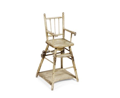 A VICTORIAN PAINTED PINE CHILD'S HIGH CHAIR with spindle back and open arms and commode seat, the chair hinged at the front t