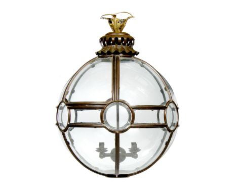 A COPPER AND GLASS SPHERICAL HALL LANTERN, the sectional body enclosing a four branch light fitting, 81cm high Originally pur