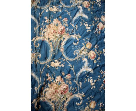 A PAIR OF FRENCH BLUE GROUND CURTAINS decorated with acanthus leaf scrolls and a variety of flowers on a blue ground approxim