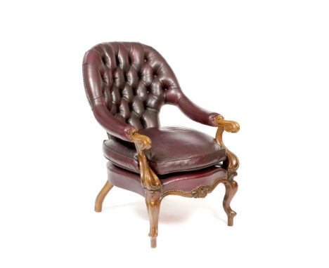 A VICTORIAN MAHOGANY LIBRARY ARMCHAIR with a purple leather button upholstered back and overstuffed upholstered arms with scr