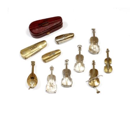 A LATE 19TH CENTURY INK WELL in the form of a miniature leather bound violin case, three old brass vesta cases in the form of