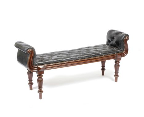 A WILLIAM IV MAHOGANY WINDOW SEAT with scroll ends, black leather button upholstery and on turned carved tapering legs, 142cm