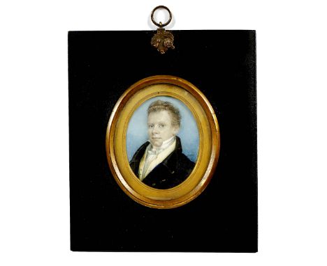 A 19TH CENTURY PORTRAIT MINIATURE of a young man in a blue overcoat, initialled I R W, 6cm x 8cm mounted in a gilt and ebony 