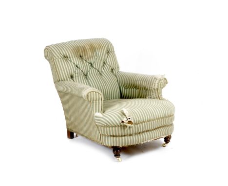 A VICTORIAN CLUB ARMCHAIR with button upholstered back and scrolling arms and with tatty green and cream upholstery, turned t