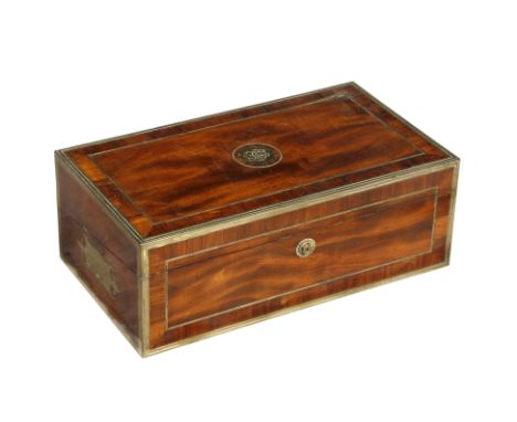 A GEORGE III MAHOGANY AND BRASS BOUND CAMPAIGN WRITING DESK the top and front with reeded brass stringing and cross banded de