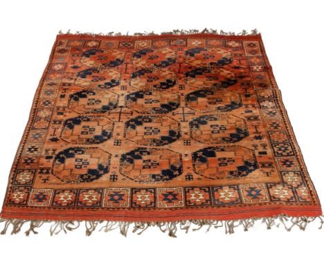 A MIDDLE EASTERN RED GROUND SMALL CARPET with three rows of five octagonal motifs and all over stylised decoration, 235cm x 2