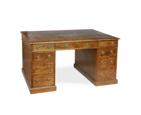 A GEORGE III MAHOGANY PARTNERS DESK, having tooled leather inset top above an arrangement of nine drawers to one side, three 