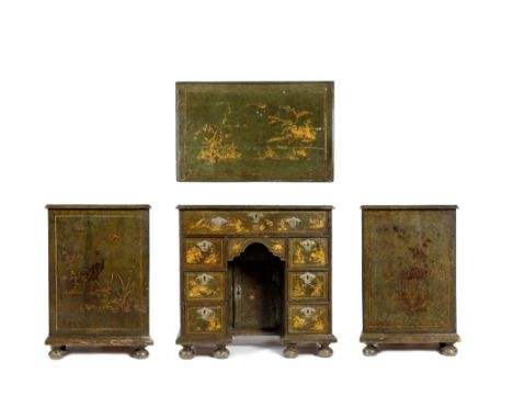 A GEORGE I GREEN LACQUERED KNEEHOLE DESK, gilt decorated with chinoiserie vignettes, having an arrangement of drawers around 