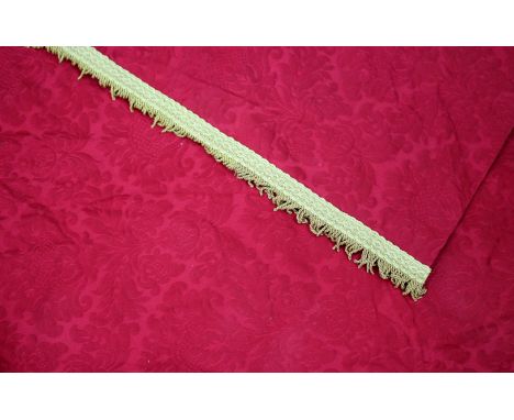 A PAIR OF FRENCH FLOWER DECORATED RED DAMASK CURTAINS with gilt fringing approximately 195cm long x approximately 540cm wide 