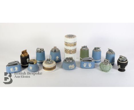 Two trays of vintage table lighters, including Wedgwood of various colours, pale blue, black, mauve, celadon green and two We