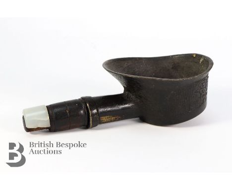 Two Chinese silk irons: first - cast from iron, the exterior depicting buddhist symbolism, the handle a mask (signs of solder