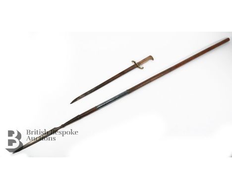 Antique throwing spear, with wooden shaft, approx 142 cms in length together with a 19th century bayonet with brass handle, m