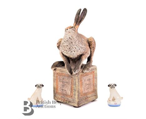 Blandine Anderson 20th century, sculpture of a hare seated on a plinth with verse, 'A wee brown cow, with a pair of leather h