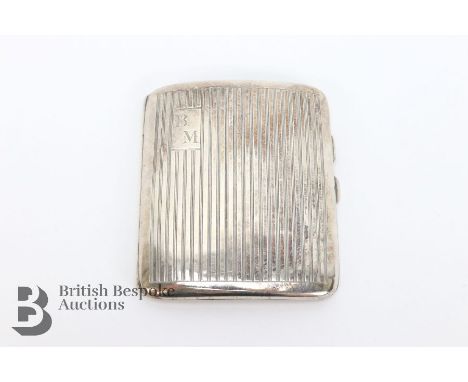 Silver engine-turned cigarette case, Birmingham hallmark, dated 1930, mm O &amp; H, approx 76.6 gms.&nbsp;