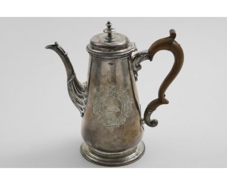 A GEORGE II TAPERING COFFEE POT with a tucked-in base, a spreading foot and a cushion-domed cover with a knop finial, engrave