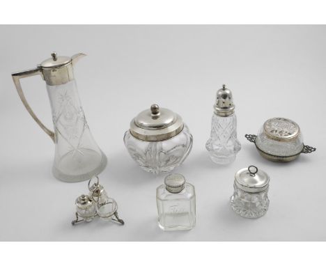 A GROUP OF VARIOUS MOUNTED CUT-GLASS ITEMS:- a claret jug, a tea caddy inscribed "MILSTEAD GARDEN FETE July 1917", a butter d