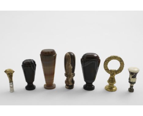 A GRADUATED PAIR OF VICTORIAN BANDED AGATE SEALS (one with intaglio monogram), two other hardstone seals (one initialled), a 
