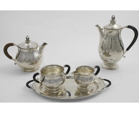 AN EARLY 20TH CENTURY DANISH COFFEE SET TO INCLUDE:- a bulbous coffee pot with a stylised crown finial and matching cream jug