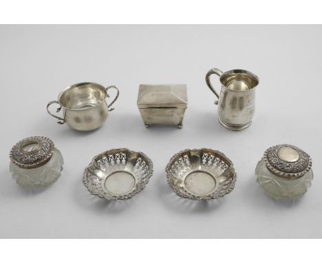 A MIXED LOT:- An Edwardian tea caddy on ball feet, by the Goldsmiths &amp; Silversmiths Co.Ltd., London 1909, a mug, inscribe