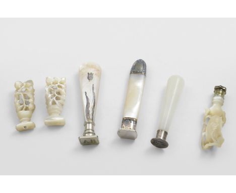 TWO LATE 19TH CENTURY CARVED MOTHER -OF-PEARL SEALS each resembling a flowering plant, another similar with a brass &amp; cov