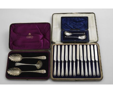 A CASED SILVERGILT FRUIT SERVING SET to include two later-decorated or "berry" table spoons and a ladle, pierced for use as a