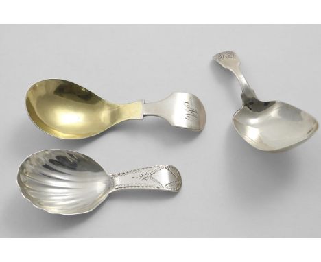 A GEORGE III CADDY SPOON with a fluted bowl and a bright-cut stem, by George Wintle, London 1805, another with a gilt, drop-s