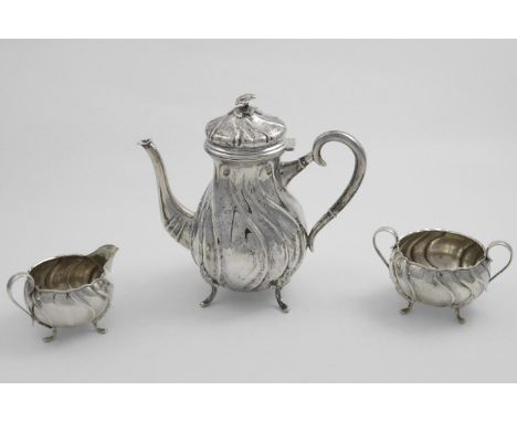 A 20TH CENTURY SCANDINAVIAN THREE-PIECE COFFEE SET with wrythen fluted bodies and scroll handles, the coffee pot with a flowe