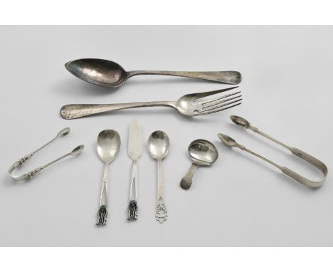 A MIXED LOT:- A pair of Dutch salad servers, two pairs of sugar tongs (one crested), a George III caddy spoon, initialled, a 