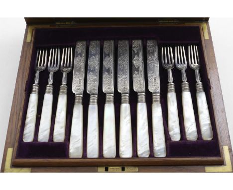 AN EDWARDIAN CASED SET OF TWELVE PAIRS OF ENGRAVED FRUIT/DESSERT KNIVES &amp; FORKS with mother -of-pearl handles by William 