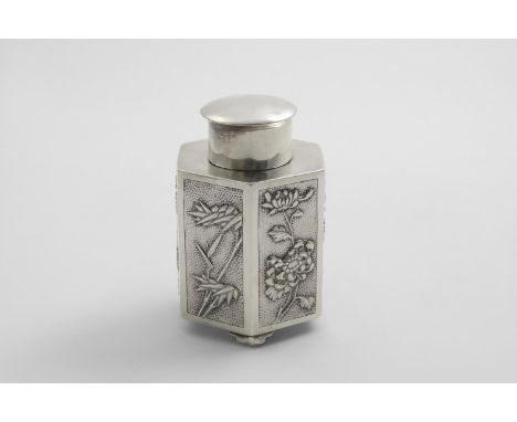 AN EARLY 20TH CENTURY CHINESE TEA CADDY hexagonal with stepped bracket feet and relief panels of flora around the sides again