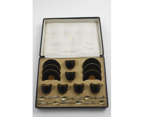 A GEORGE V CASED WORCESTER PORCELAIN DEMI-TASSE COFFEE SERVICE FOR SIX with gilt-decorated black cups &amp; saucers and six s