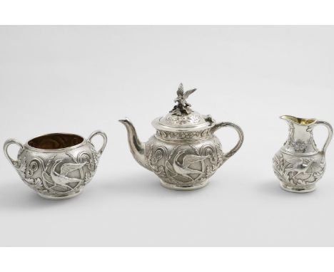 A LATE VICTORIAN BACHELOR'S THREE-PIECE TEA SET with globular bodies, decorated around the sides in relief with birds, scroll