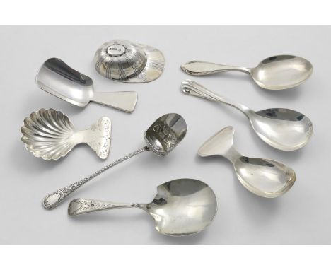 EIGHT VARIOUS GEORGE V CADDY SPOONS including a "jockey cap", mixed makers &amp; dates; the longest one 4.3"  (11 cms) long; 