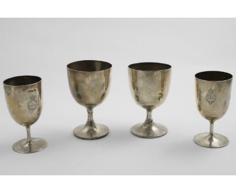 REGIMENTAL INTEREST:- Two late Victorian goblets, engraved with the badge of the "3rd Battalion Manchester Regiment"; one ins