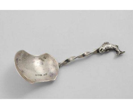 A GEORGE V CADDY SPOON with a waisted shovel bowl, a twist stem and a cast fish terminal, by A.E. Bonner, London 1913;  4"  (